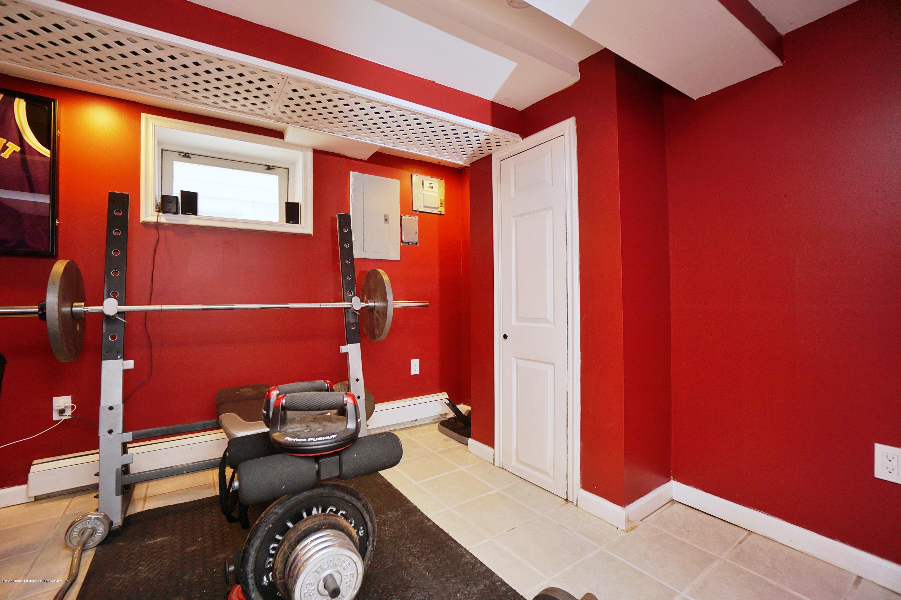 141 Roe Street Staten Island, NY 10310 - Photo 22 of 30 (22) FINISHED BASEMENT GYM AREA