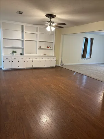 a view of a room with closet and fan