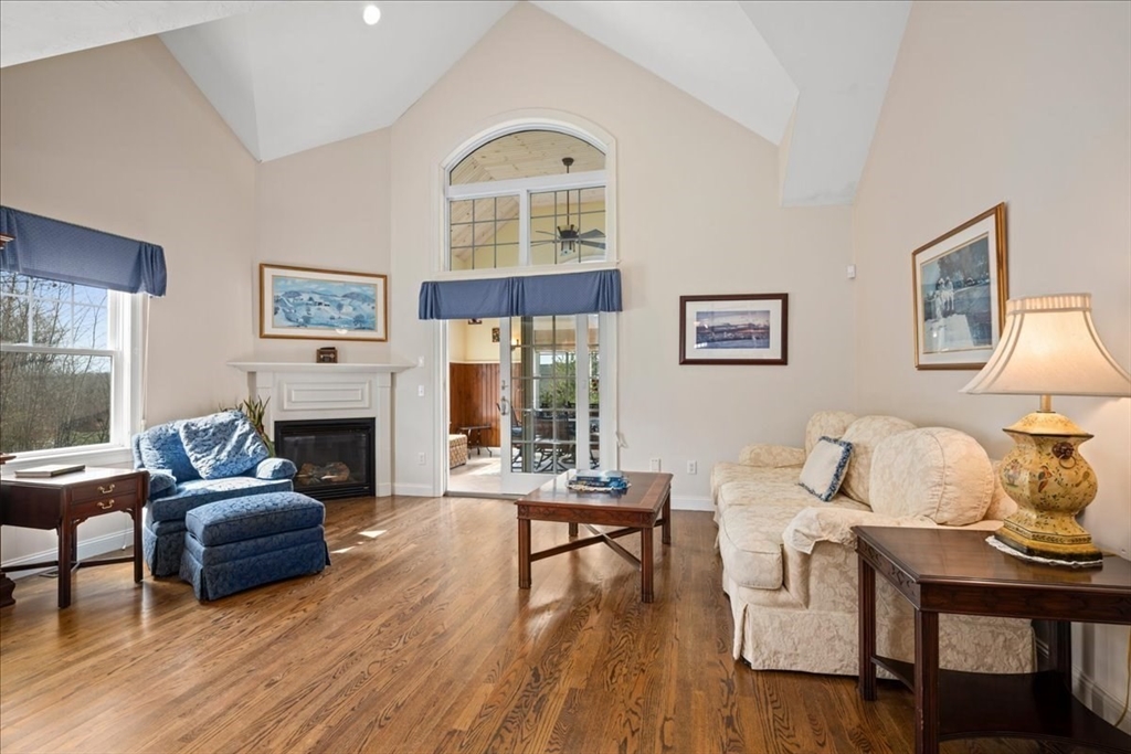 7 Primmett Lane, Unit 7 Worcester, MA 01609 - Photo 8 of 38 a living room with furniture fireplace and a table