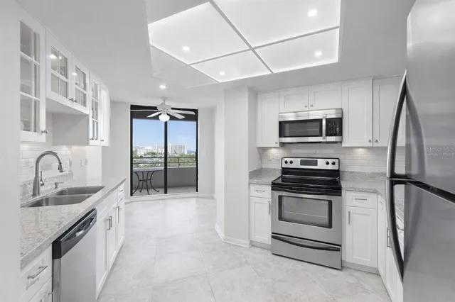 a view of a livingroom with a ceiling fan and window