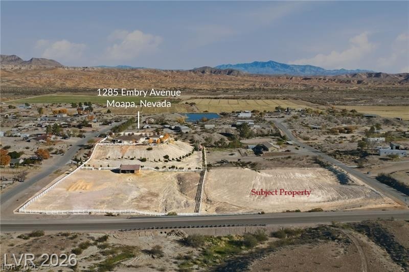 Turvey & Henry Moapa, NV 89025 - Photo 4 of 5 A desert landscape unfolds with distant mountains, offering expansive views and potential for development.