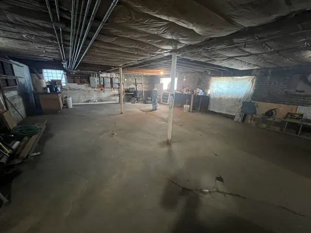 a view of empty room with wooden ceiling