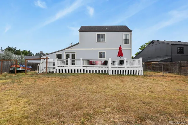 a view of house with outdoor space and swimming pool