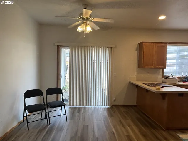 a bedroom with a bed and a mirror on the dresser