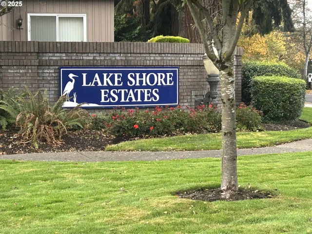 a backyard of a house with lots of green space and fountain