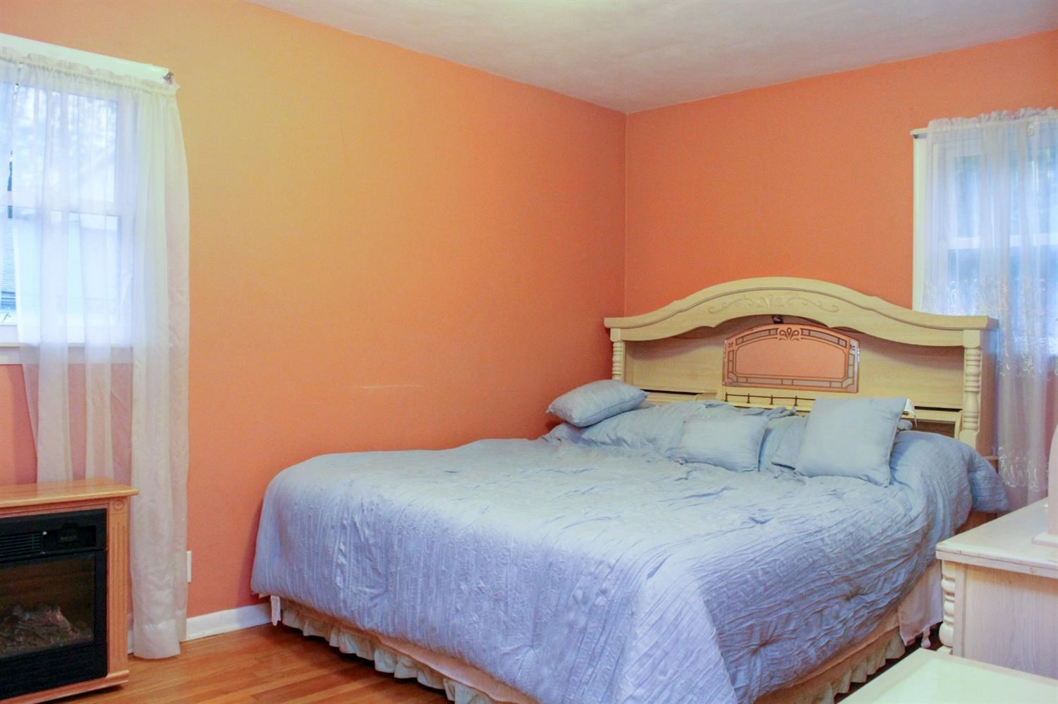 4219 Rutledge Street Gary, IN 46408 - Photo 13 of 27 a bedroom with a bed and a potted plant