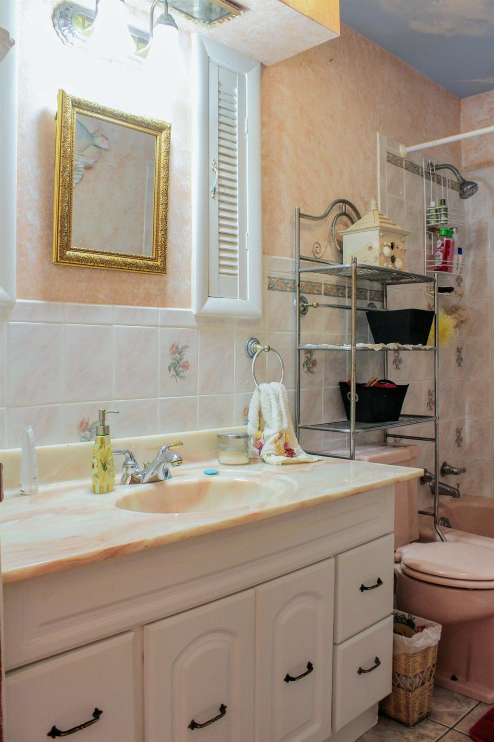 4219 Rutledge Street Gary, IN 46408 - Photo 15 of 27 a bathroom with a sink a toilet and vanity