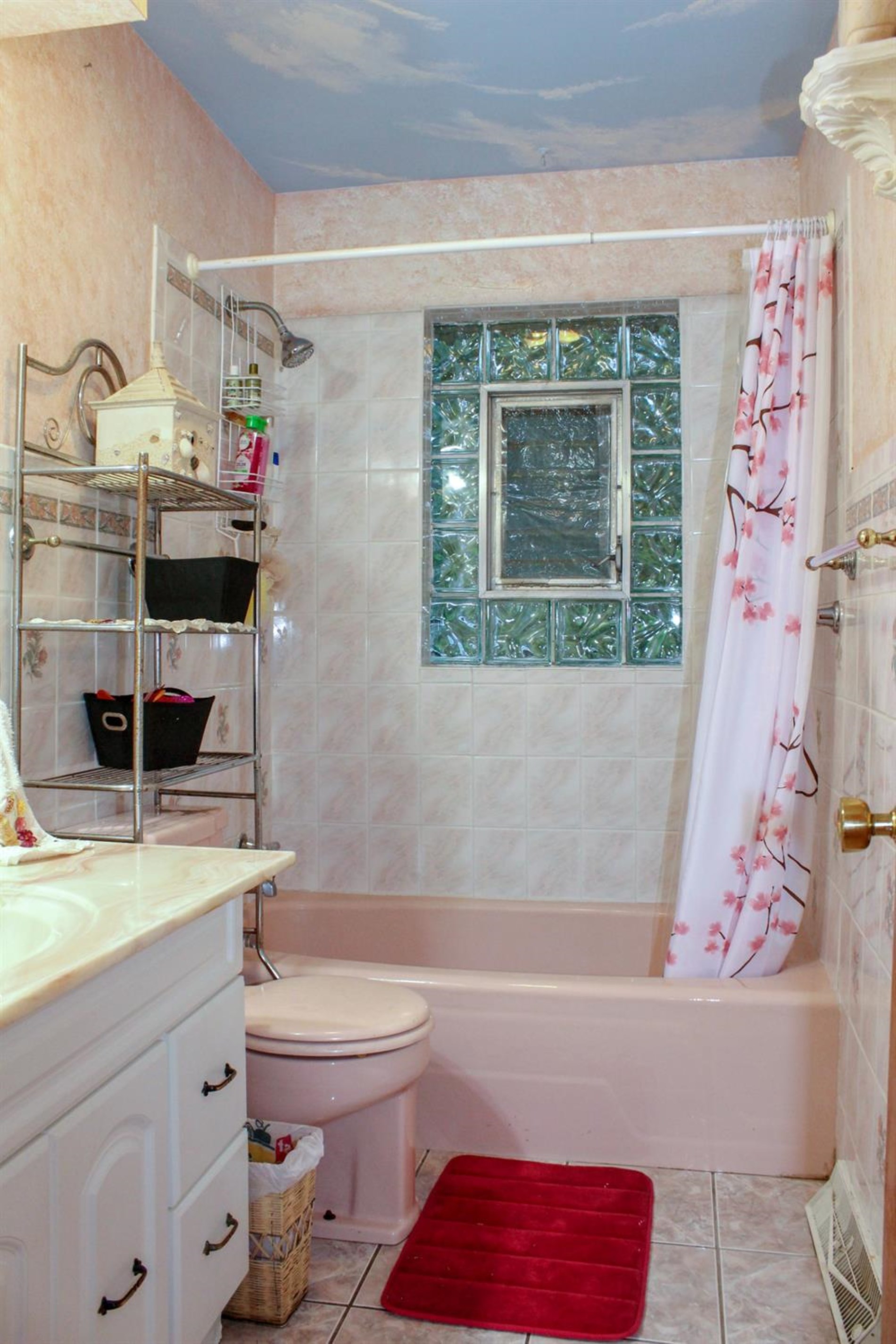 4219 Rutledge Street Gary, IN 46408 - Photo 16 of 27 a bathroom with a sink a toilet and shower