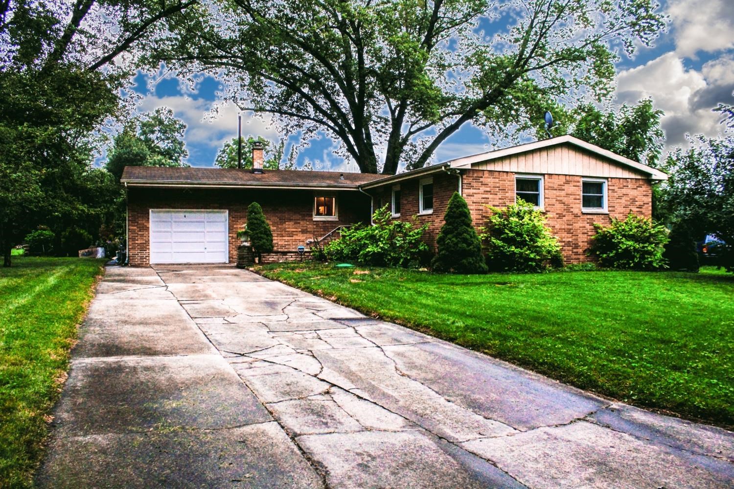 4219 Rutledge Street Gary, IN 46408 - Photo 2 of 27 a front view of a house with garden