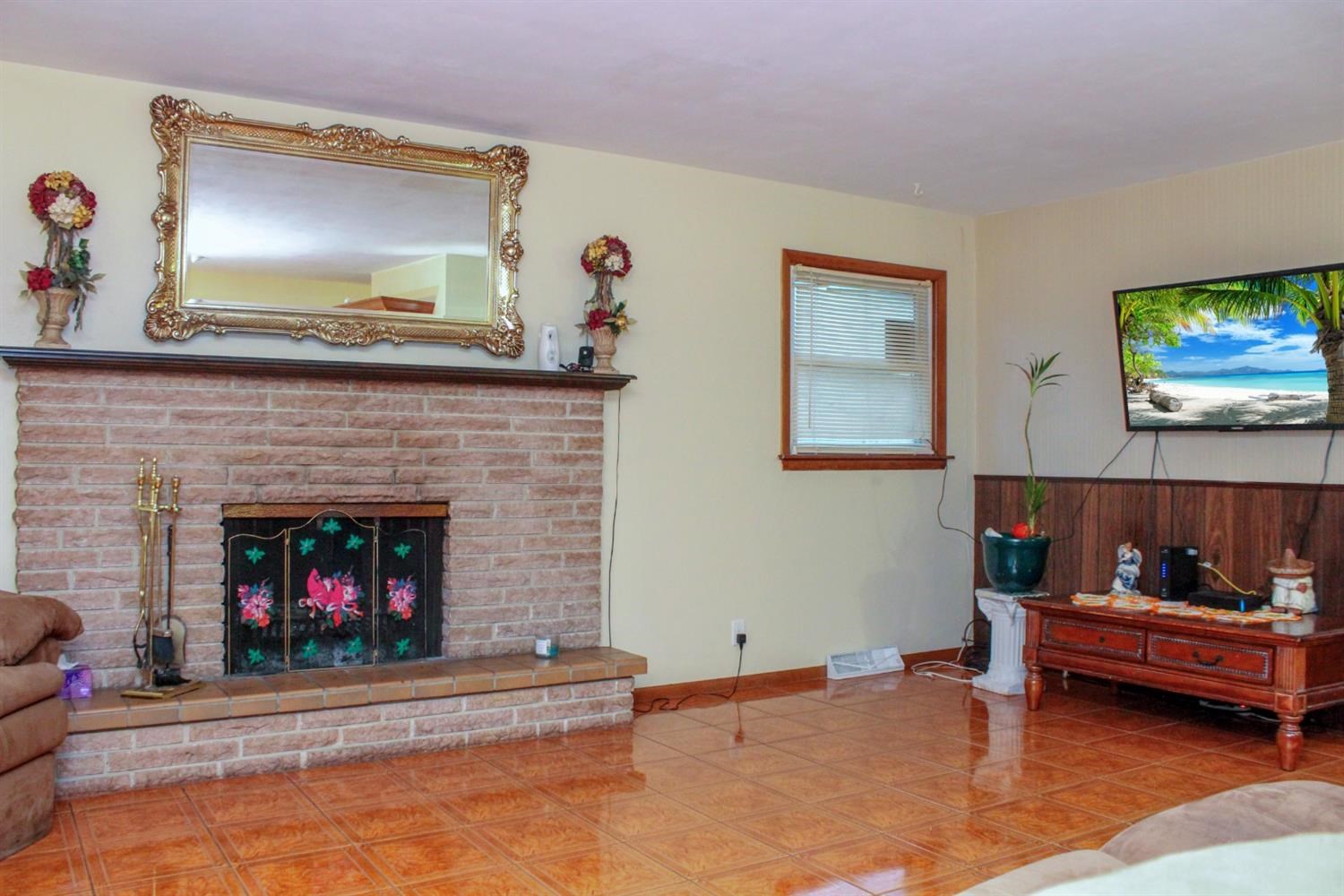 4219 Rutledge Street Gary, IN 46408 - Photo 9 of 27 a living room with furniture and a fireplace