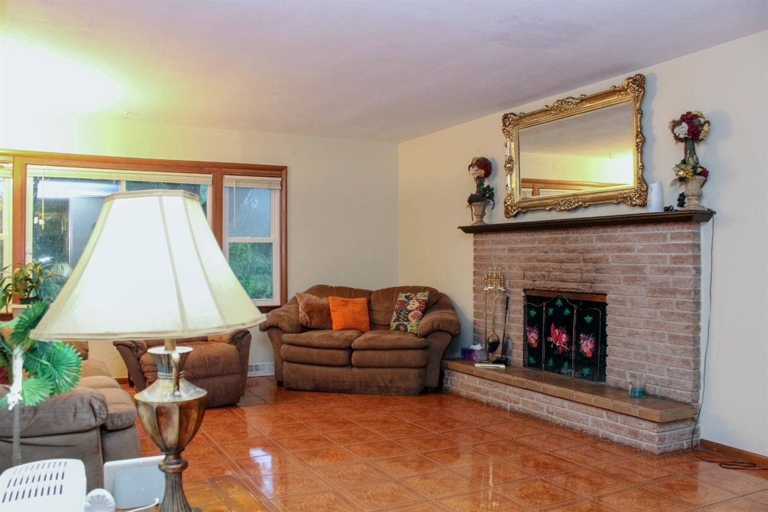 4219 Rutledge Street Gary, IN 46408 - Photo 10 of 27 a living room with furniture and a fireplace