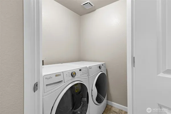 a view of washer and dryer in a utility room