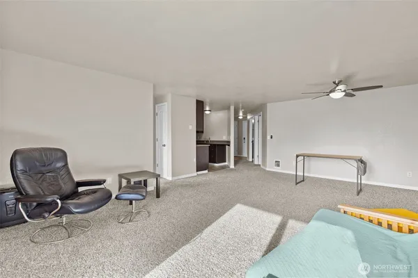 a living room with furniture and a chair