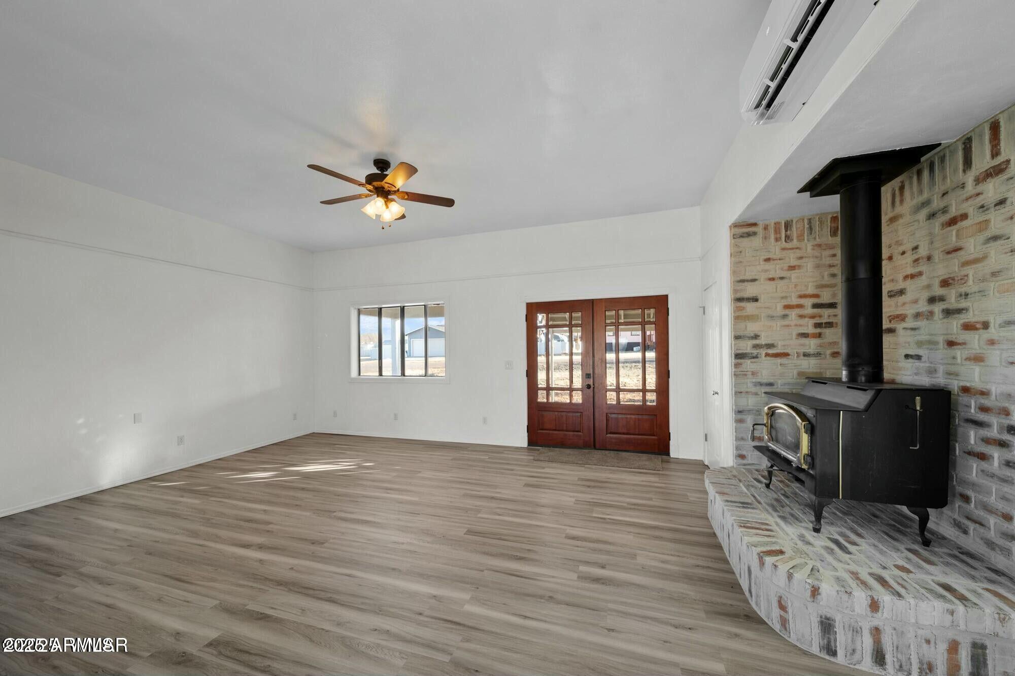 723 Tori Circle Springerville, AZ 85938 - Photo 14 of 47 wooden floor in an empty room with a window