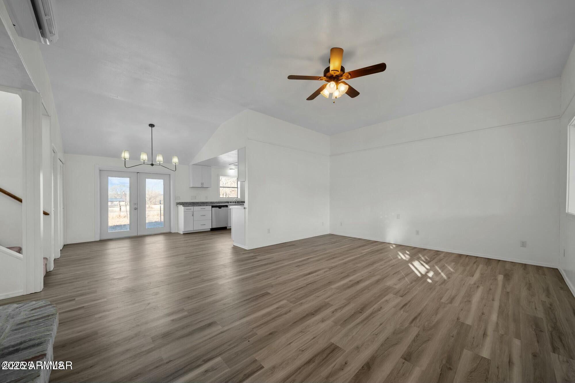 723 Tori Circle Springerville, AZ 85938 - Photo 16 of 47 a view of empty room with wooden floor and ceiling fan