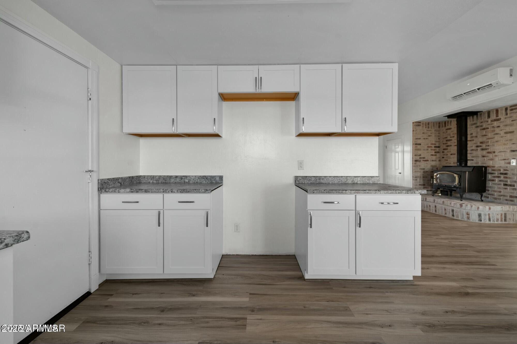 723 Tori Circle Springerville, AZ 85938 - Photo 21 of 47 a kitchen with cabinets appliances and wooden floor