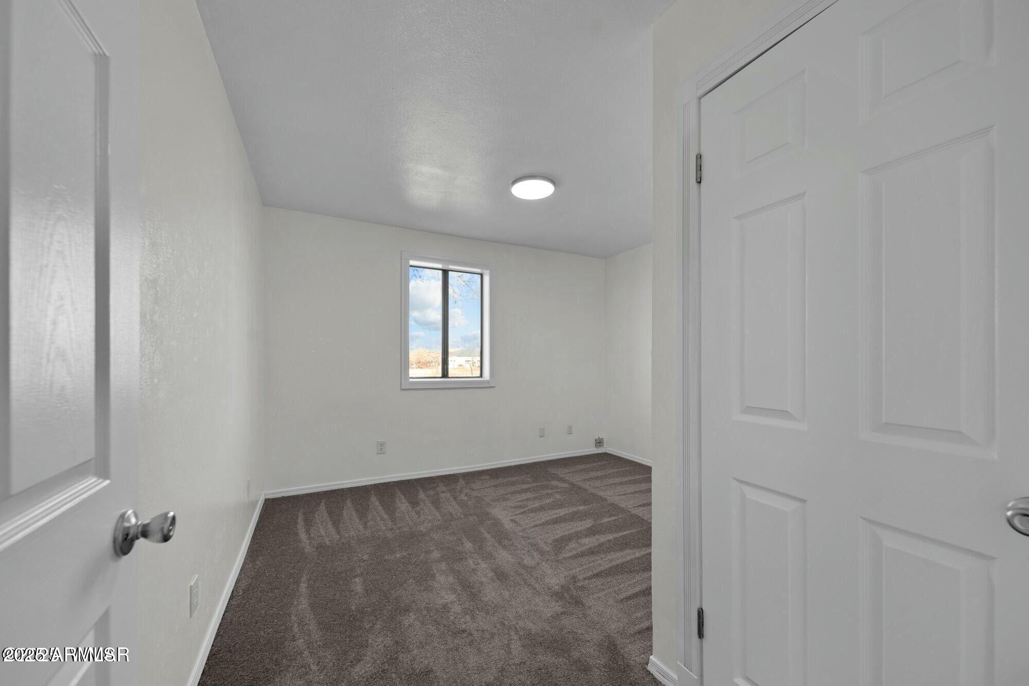 723 Tori Circle Springerville, AZ 85938 - Photo 23 of 47 a view of an empty room with a window