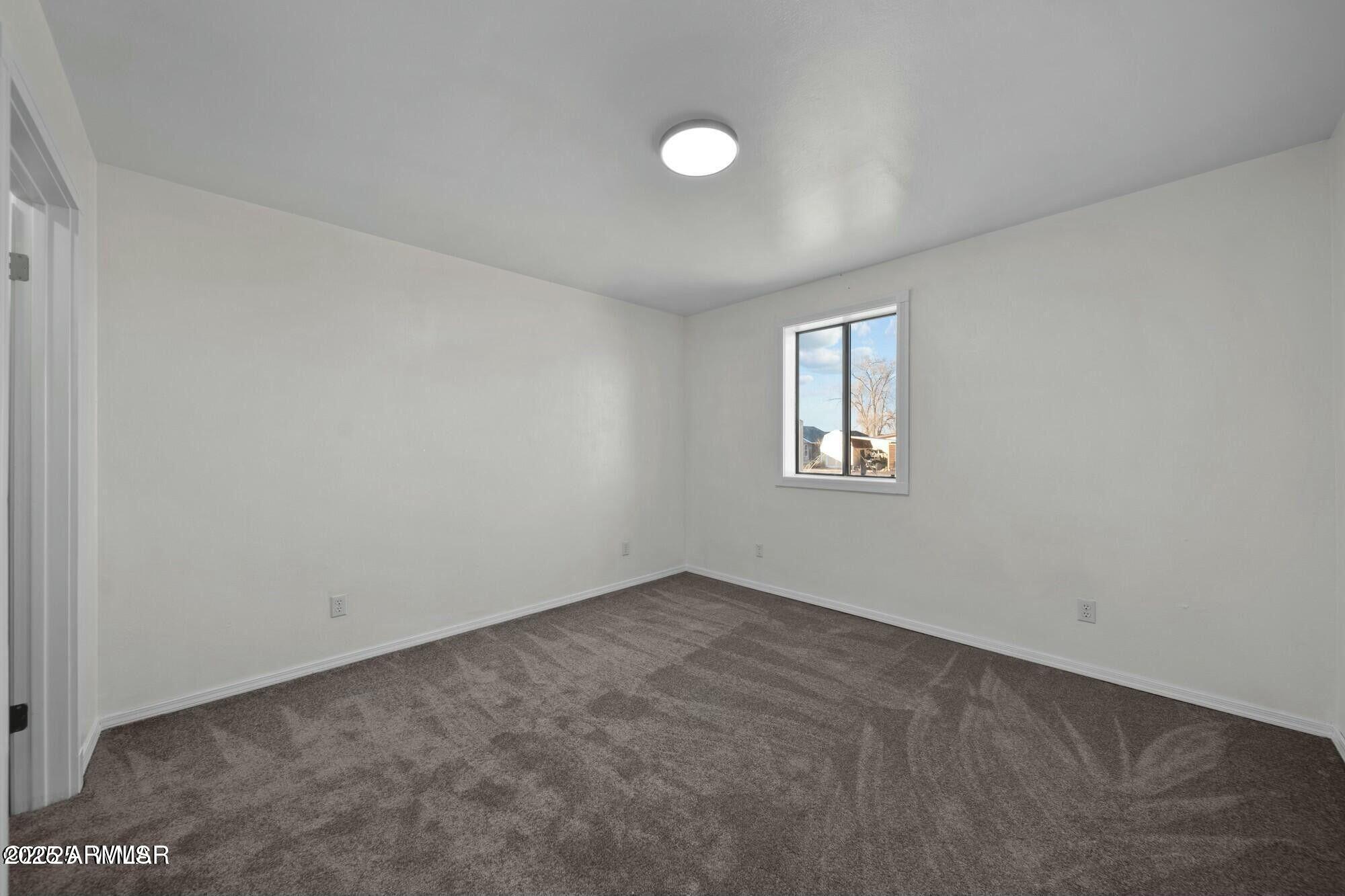 723 Tori Circle Springerville, AZ 85938 - Photo 25 of 47 an empty room with windows and closet