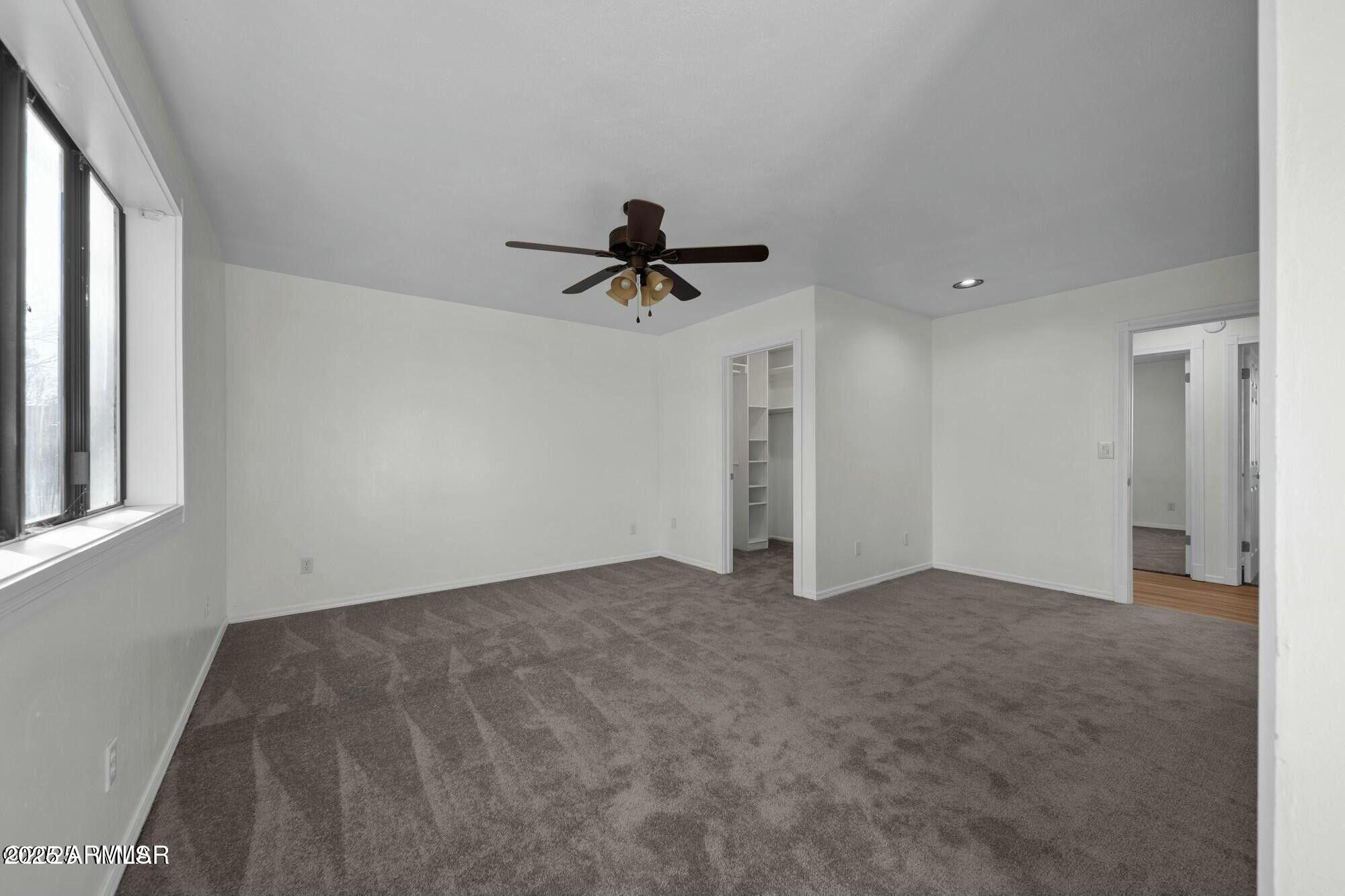723 Tori Circle Springerville, AZ 85938 - Photo 28 of 47 an empty room with a ceiling fan and a window