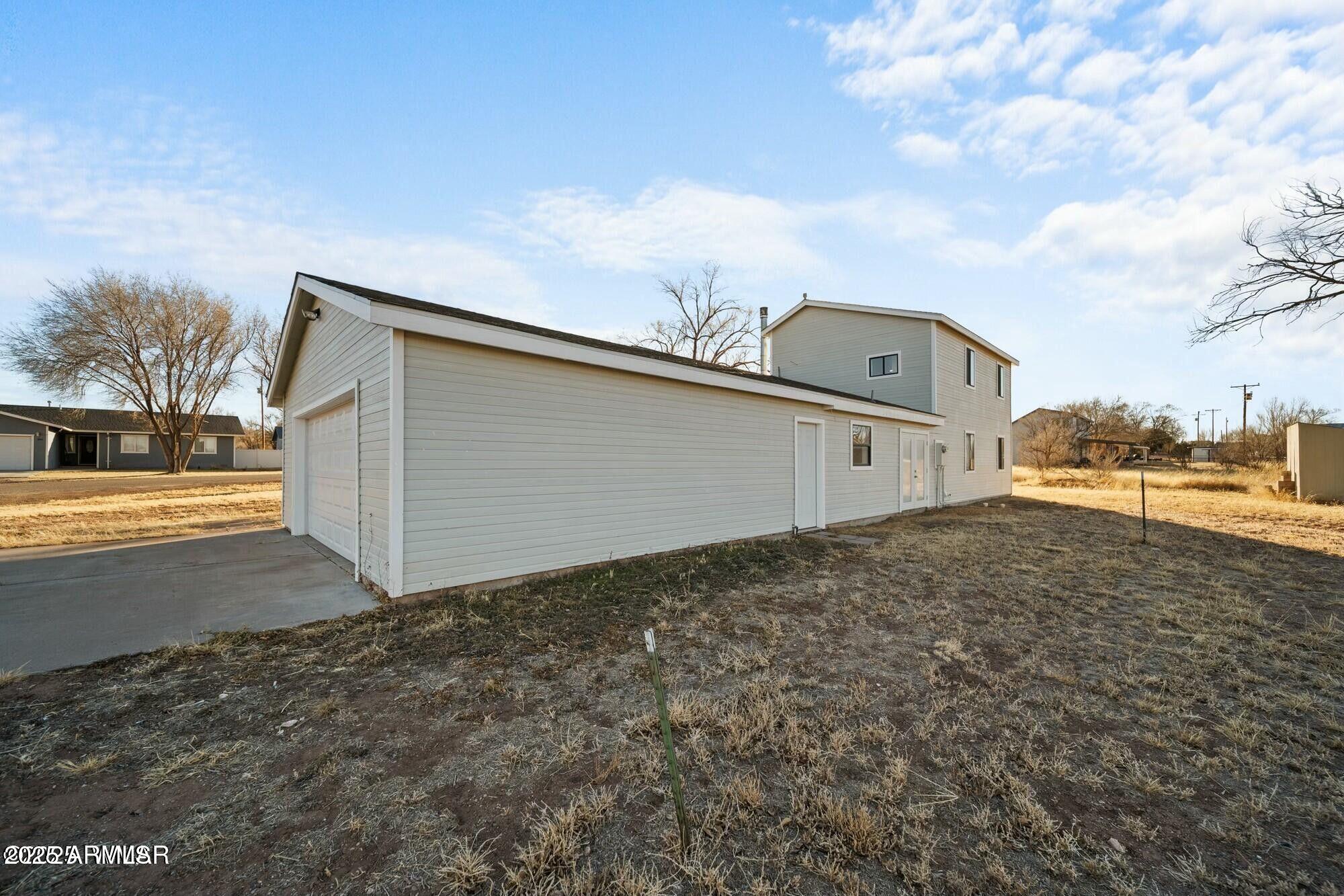 723 Tori Circle Springerville, AZ 85938 - Photo 37 of 47 a view of a big house with wooden fence