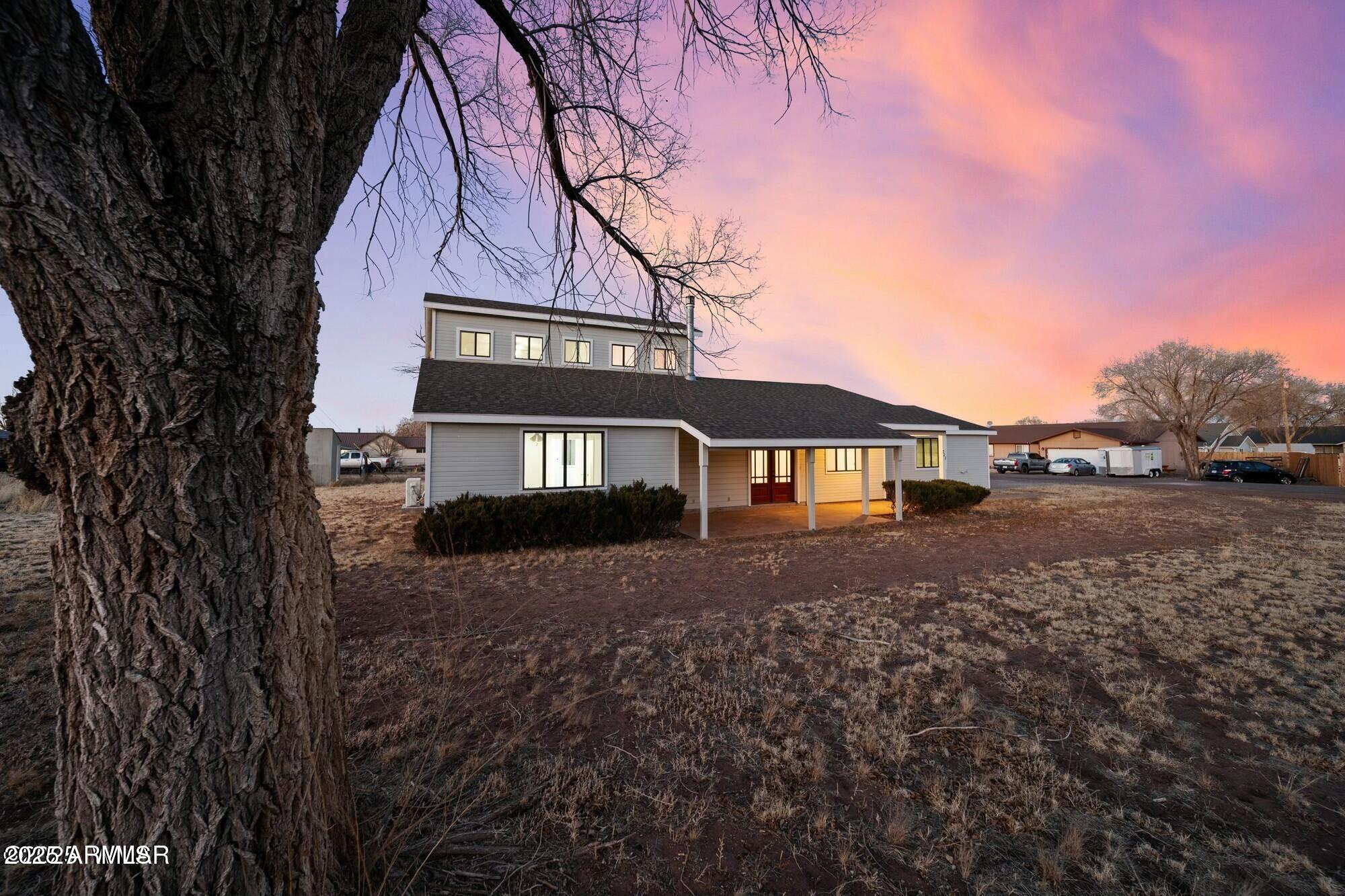 723 Tori Circle Springerville, AZ 85938 - Photo 6 of 47 a front view of a house with yard and garage