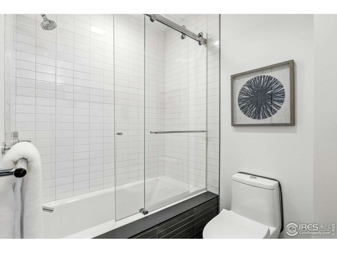 1360 Walnut Street, Unit 401 Boulder, CO 80302 - Photo 16 of 18 a bathroom with a shower and a toilet