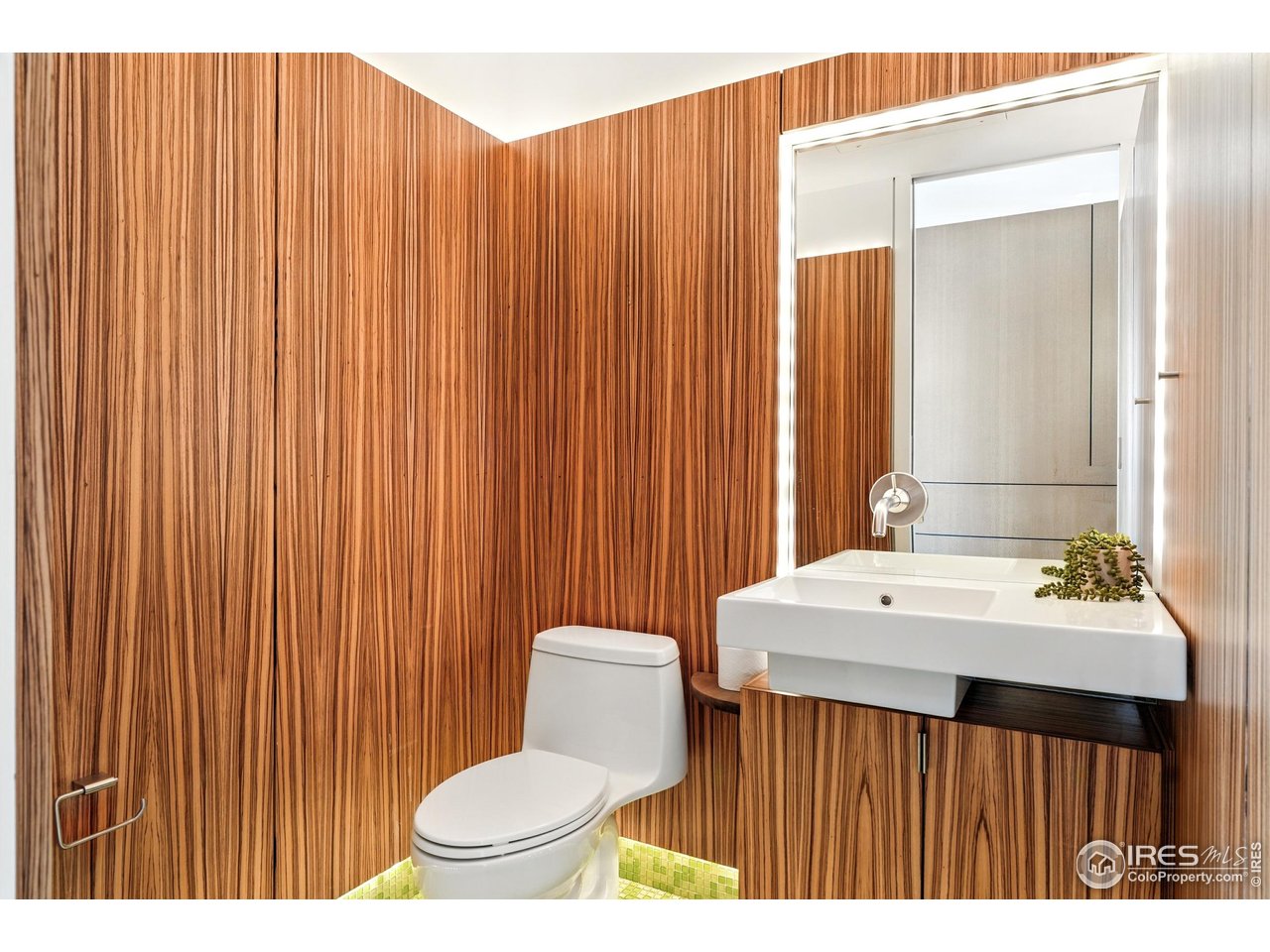 1360 Walnut Street, Unit 401 Boulder, CO 80302 - Photo 8 of 18 a bathroom with a sink a toilet and mirror