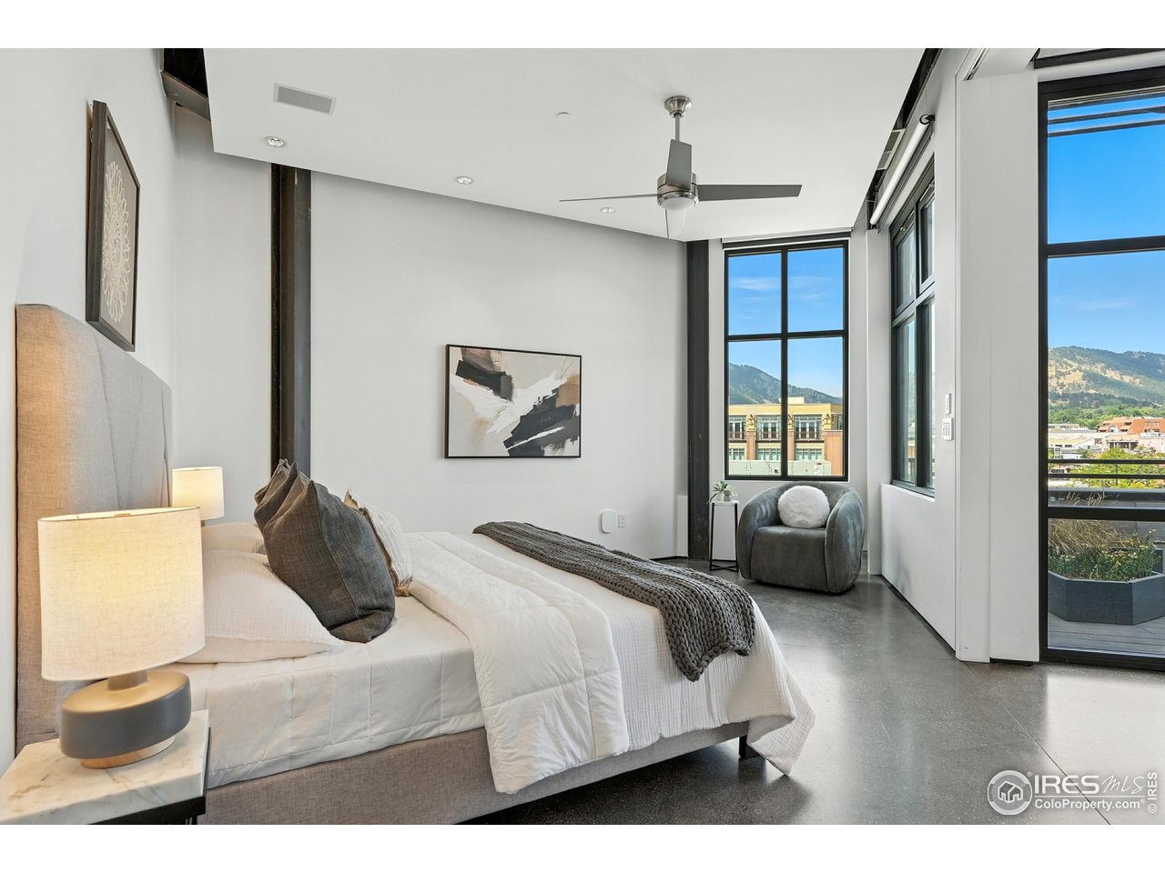 1360 Walnut Street, Unit 401 Boulder, CO 80302 - Photo 10 of 18 a bedroom with a bed couch and window