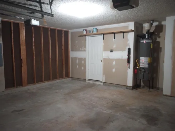 a view of empty room with wooden walls