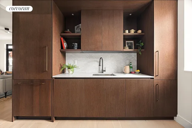 a kitchen with a sink and cabinets