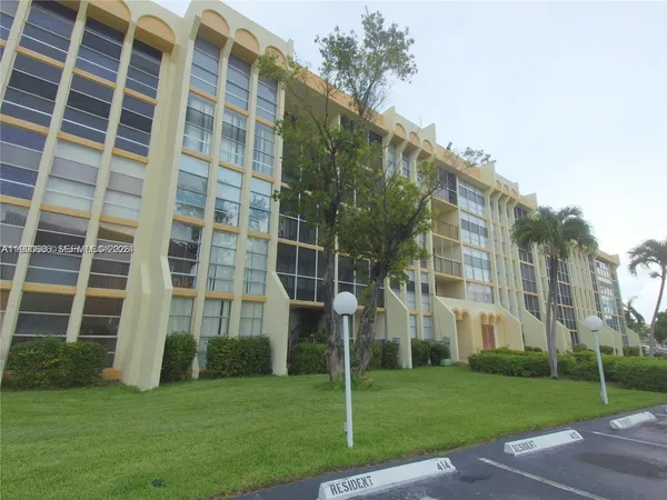 a view of a building with a yard