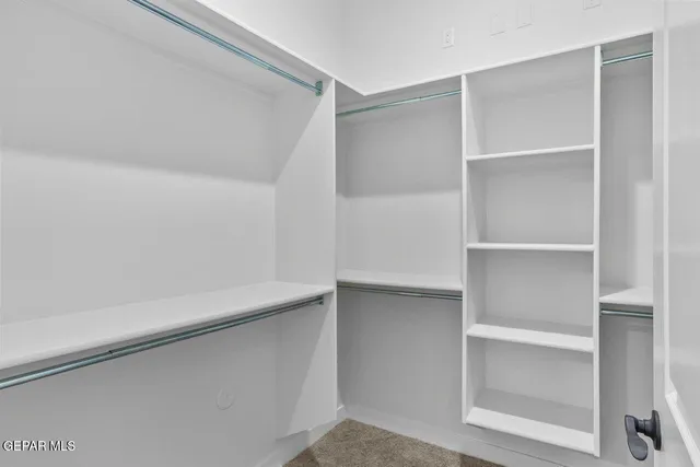 a view of an empty walk in closet