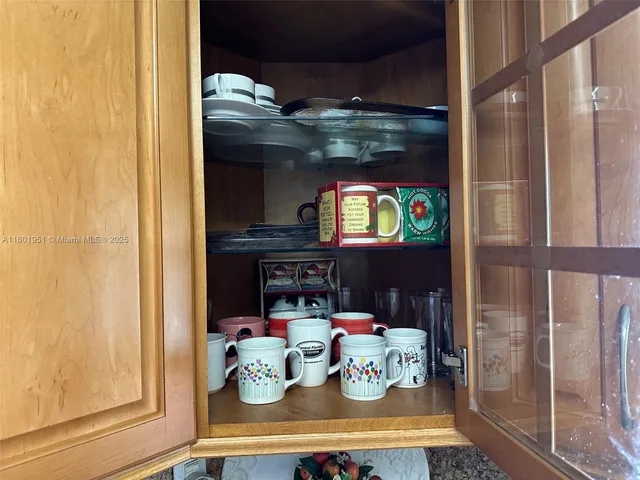 a bathroom with a sink mirror and toilet
