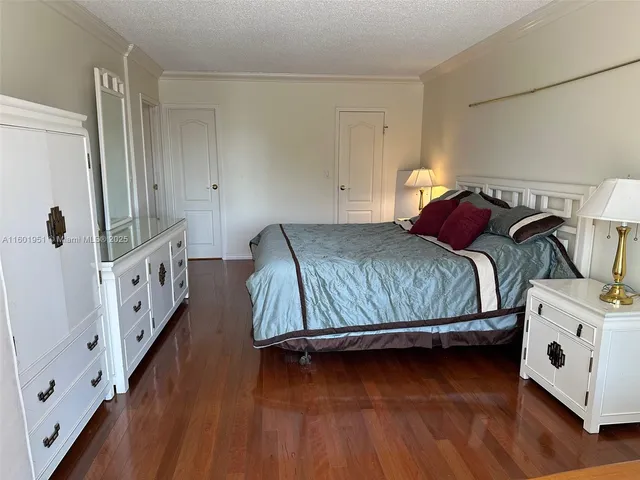 a bathroom with a granite countertop sink a toilet and mirror