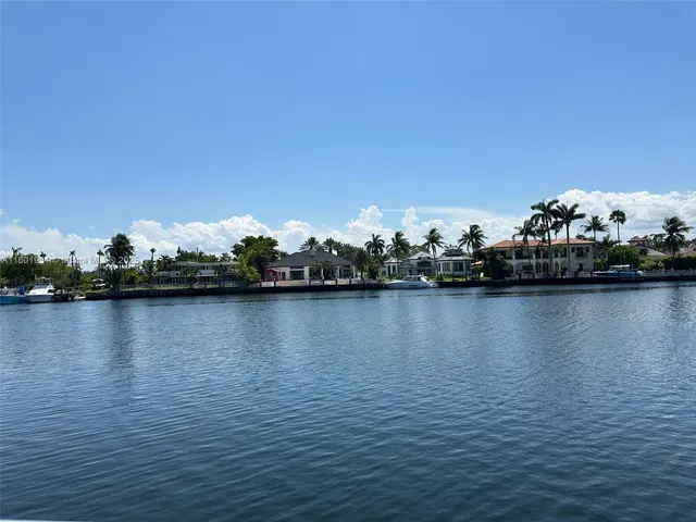 a view of a swimming pool with outdoor seating