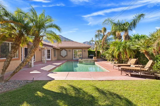 a view of a yard with an ocean view