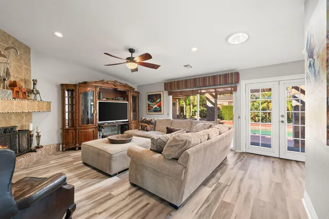 a living room with furniture and a large window