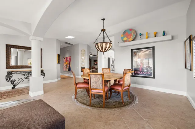 a bathroom with a granite countertop shower sink vanity and toilet