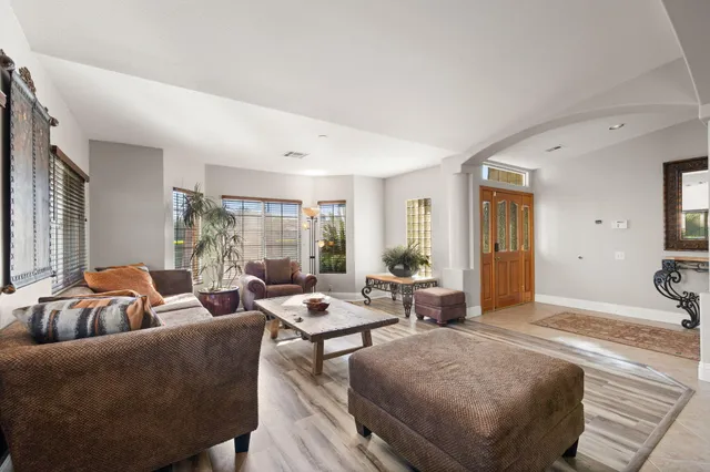 a front view of a house with a yard and porch