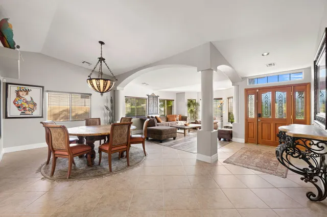 a view of a house with swimming pool yard and sitting area