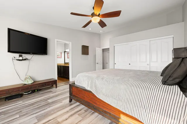 an aerial view of a house with table and chairs