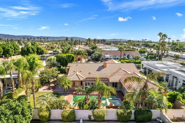 a living room with furniture fireplace and a flat screen tv