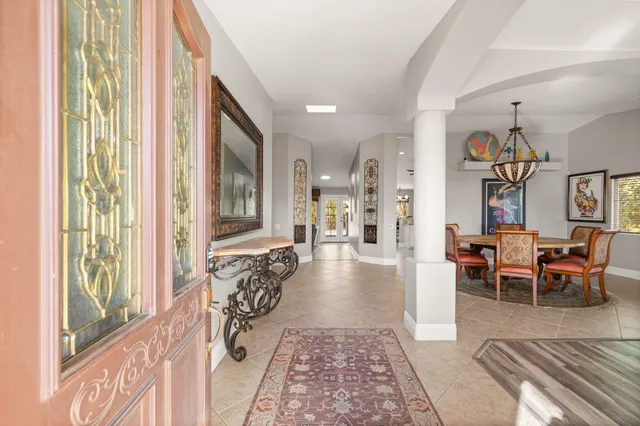 a kitchen with a sink and large window