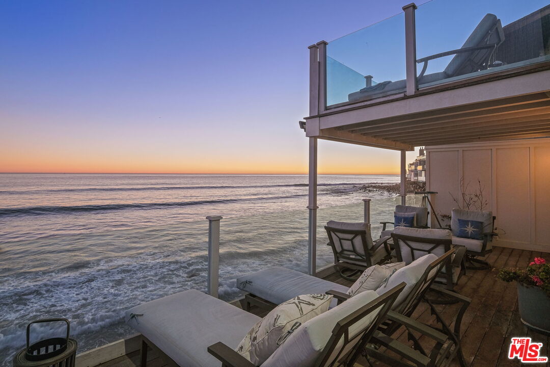 19236 Pacific Coast Highway Malibu, CA 90265 - Photo 2 of 41 a view of a balcony with chairs and a table