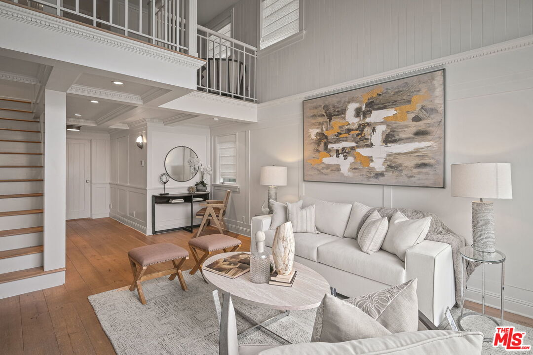 19236 Pacific Coast Highway Malibu, CA 90265 - Photo 14 of 41 a living room with furniture a wooden floor and a large window