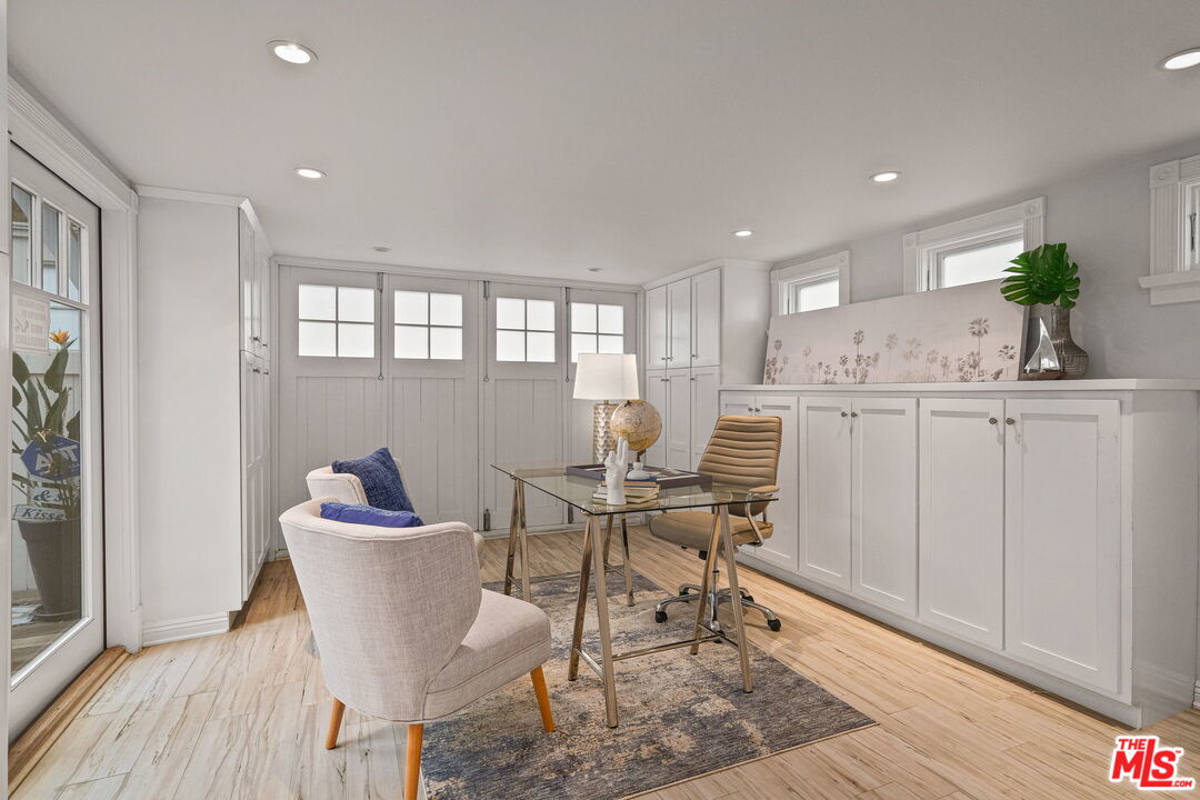 19236 Pacific Coast Highway Malibu, CA 90265 - Photo 20 of 41 a view of a dining room with furniture and wooden floor