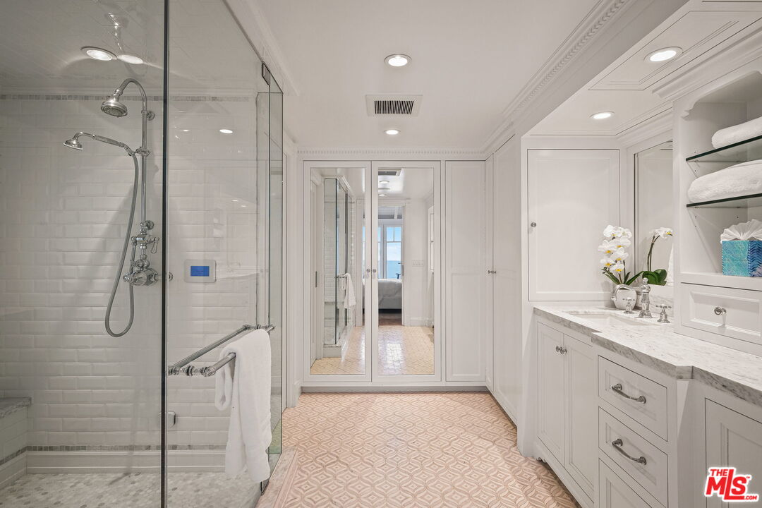 19236 Pacific Coast Highway Malibu, CA 90265 - Photo 30 of 41 a bathroom with a double vanity sink shower and mirror