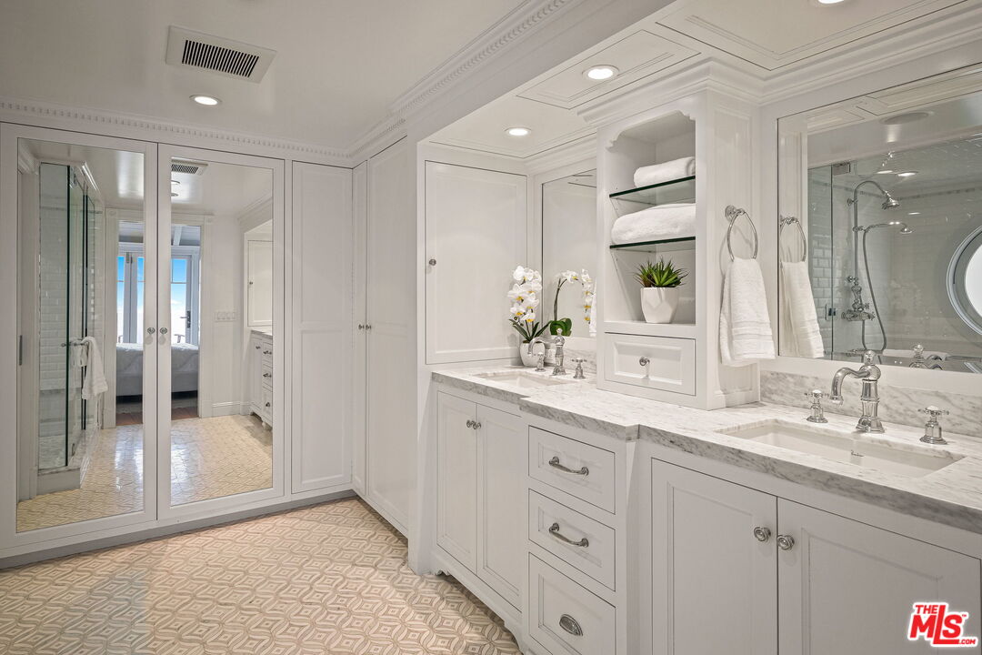 19236 Pacific Coast Highway Malibu, CA 90265 - Photo 31 of 41 a bathroom with a granite countertop sink mirror and double