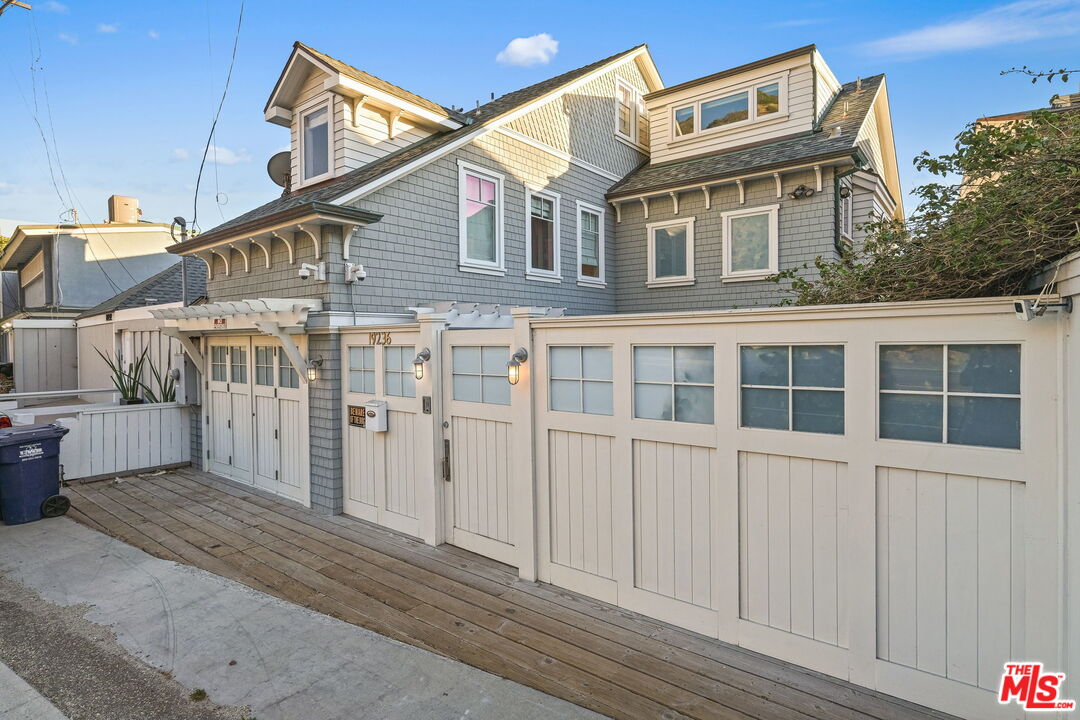 19236 Pacific Coast Highway Malibu, CA 90265 - Photo 5 of 41 a front view of a house with a yard