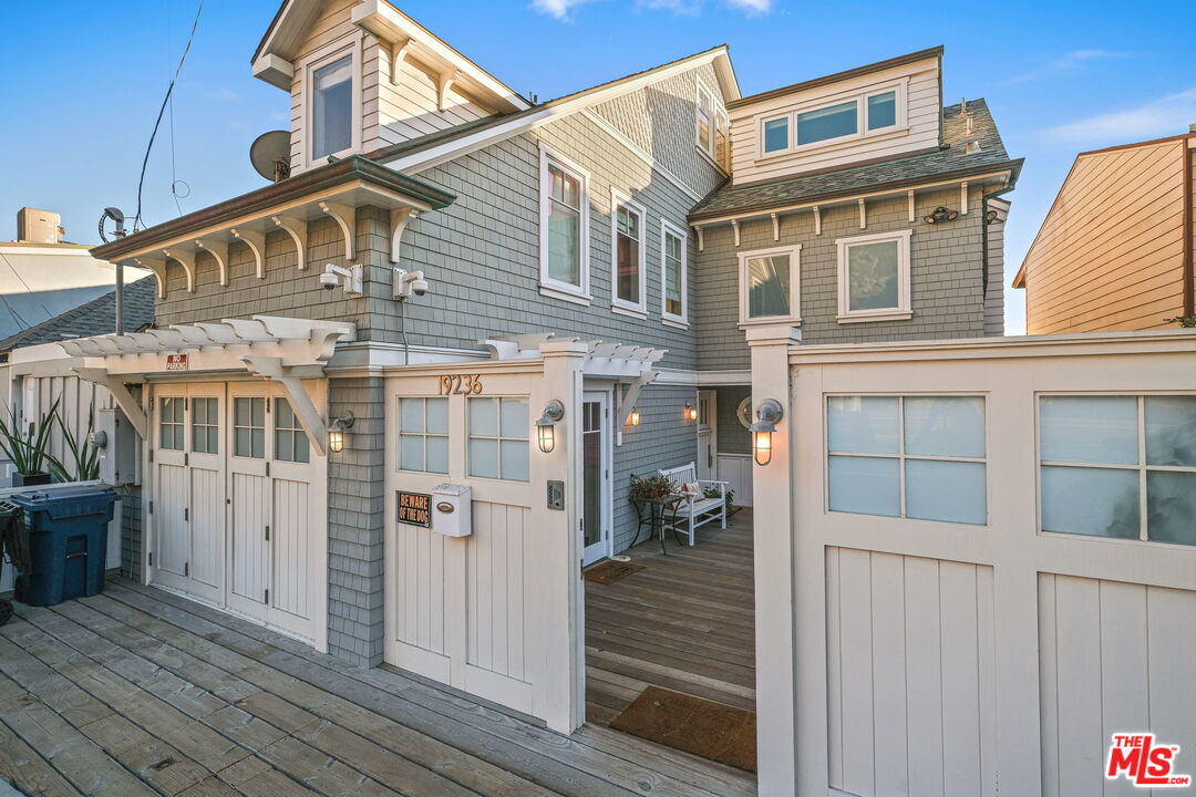 19236 Pacific Coast Highway Malibu, CA 90265 - Photo 6 of 41 a front view of a house with a glass door